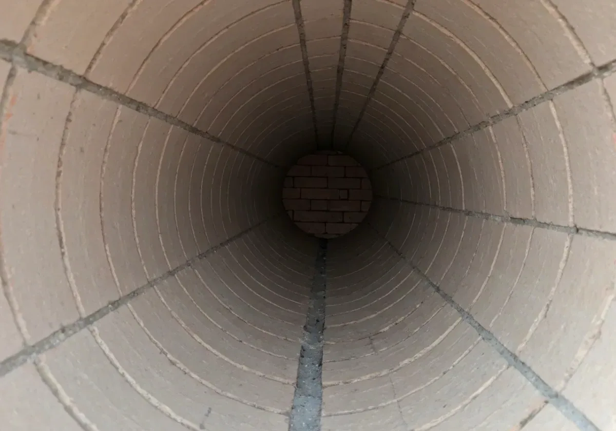 After — creosote removal: Stage 3 glazed creosote taken off the flue walls, back to clean masonry.
